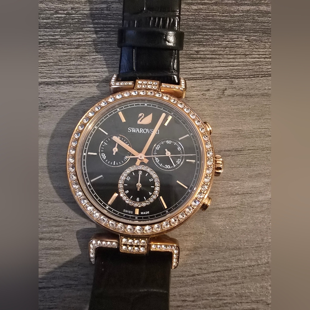 Swarovski Black and Gold Watch - Used but in great condition